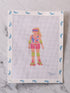 Cross-stitched pattern of a person roller skating on fabric with blue butterfly designs.