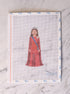 Cross-stitch pattern with a princess in a red dress on a white fabric background