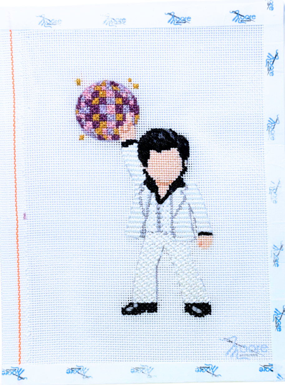 Cross-stitched design of a person with a mirror ball on a grid background